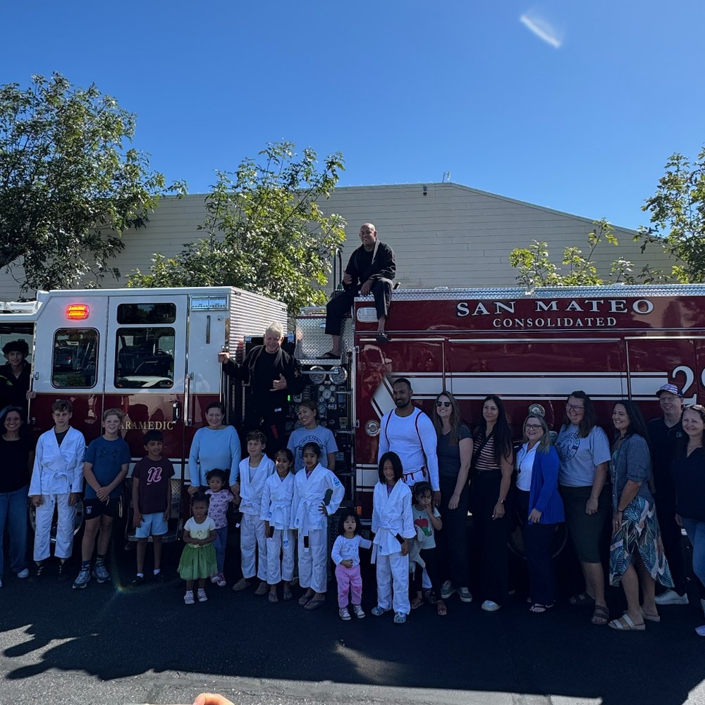 Grand opening crowd with the fire crew and their engine
