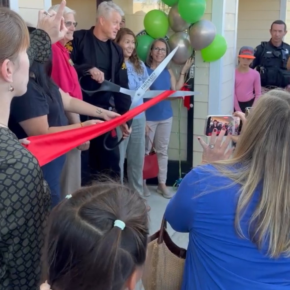 Ribbon cutting outside the academy on opening day
