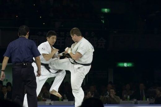 Matt 'Sumo' Shriner delivering a kick in a karate match in Japan